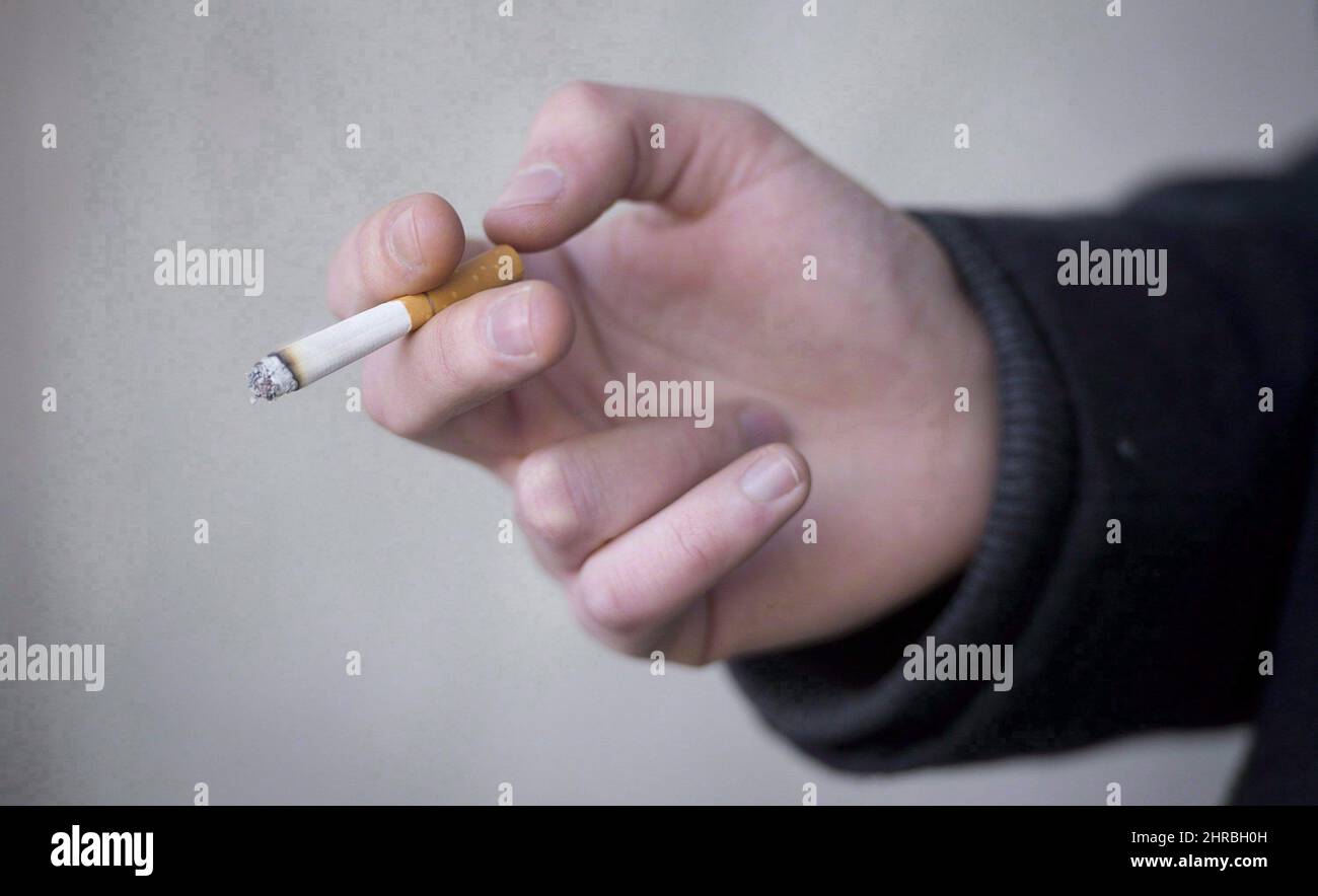 cigarette b&h A smoker holds a cigarette during a smoke break outside a building in North  Vancouver, B.C. Monday, Jan. 20, 2014. A new report suggests fewer  Canadians are smoking tobacco.The Canadian Community Health