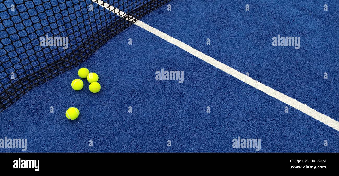 Yellow balls on tennis court Stock Photo Alamy