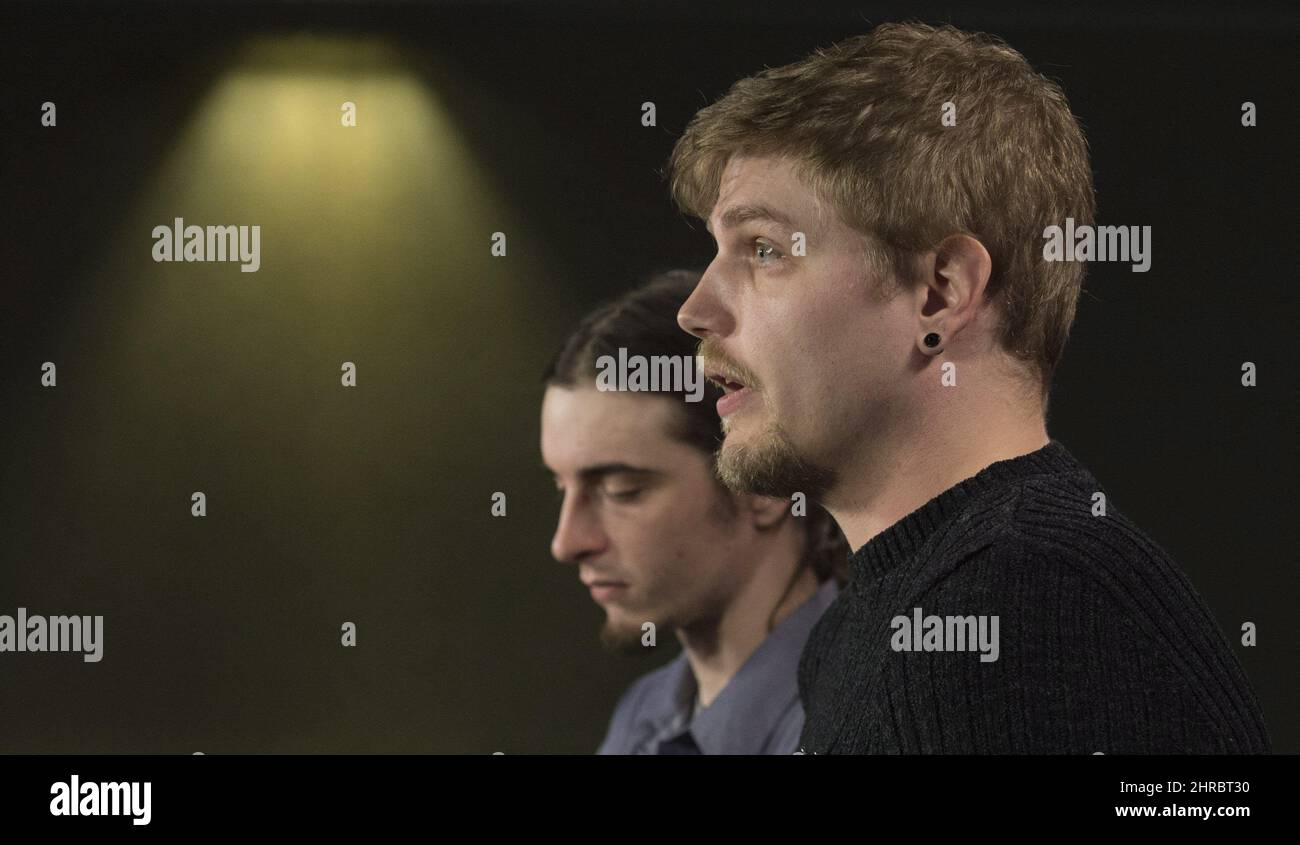 Marijuana activist Shaun Mac, left, listens to Alex Newcombe speak ...