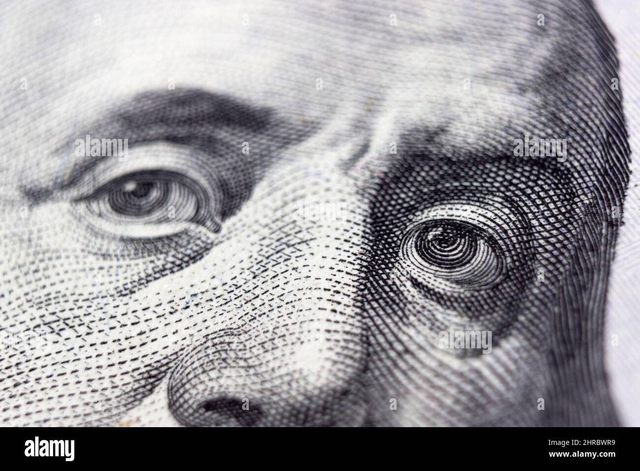 United states hundred dollars money bill, Benjamin Franklin's eyes from a fragment of new 100 dollar Stock Photo