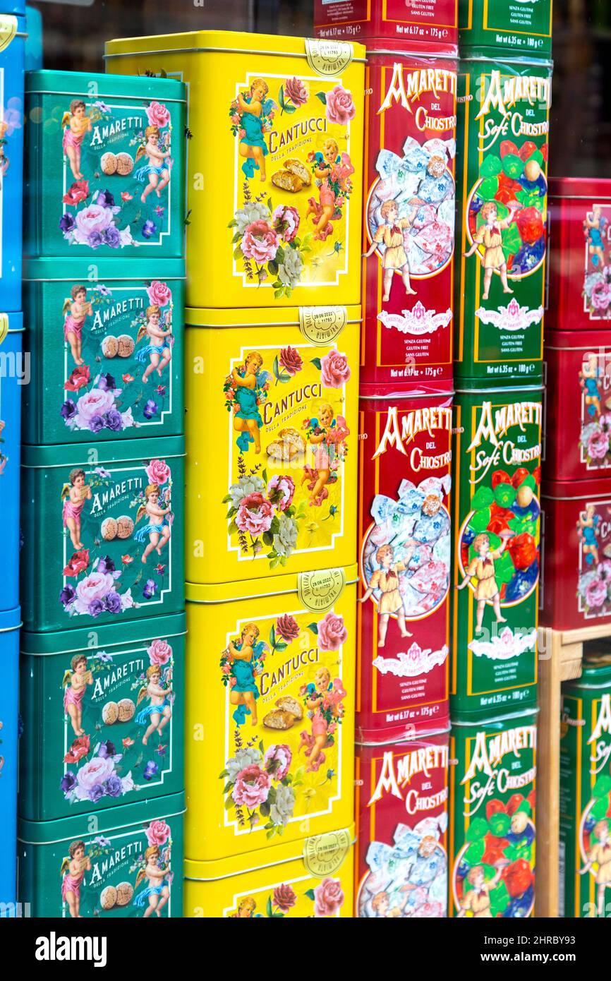 Display of colourful tins with Italian cookies at a deli (The Little Deli, Hitchin, Hertfordshire, UK) Stock Photo