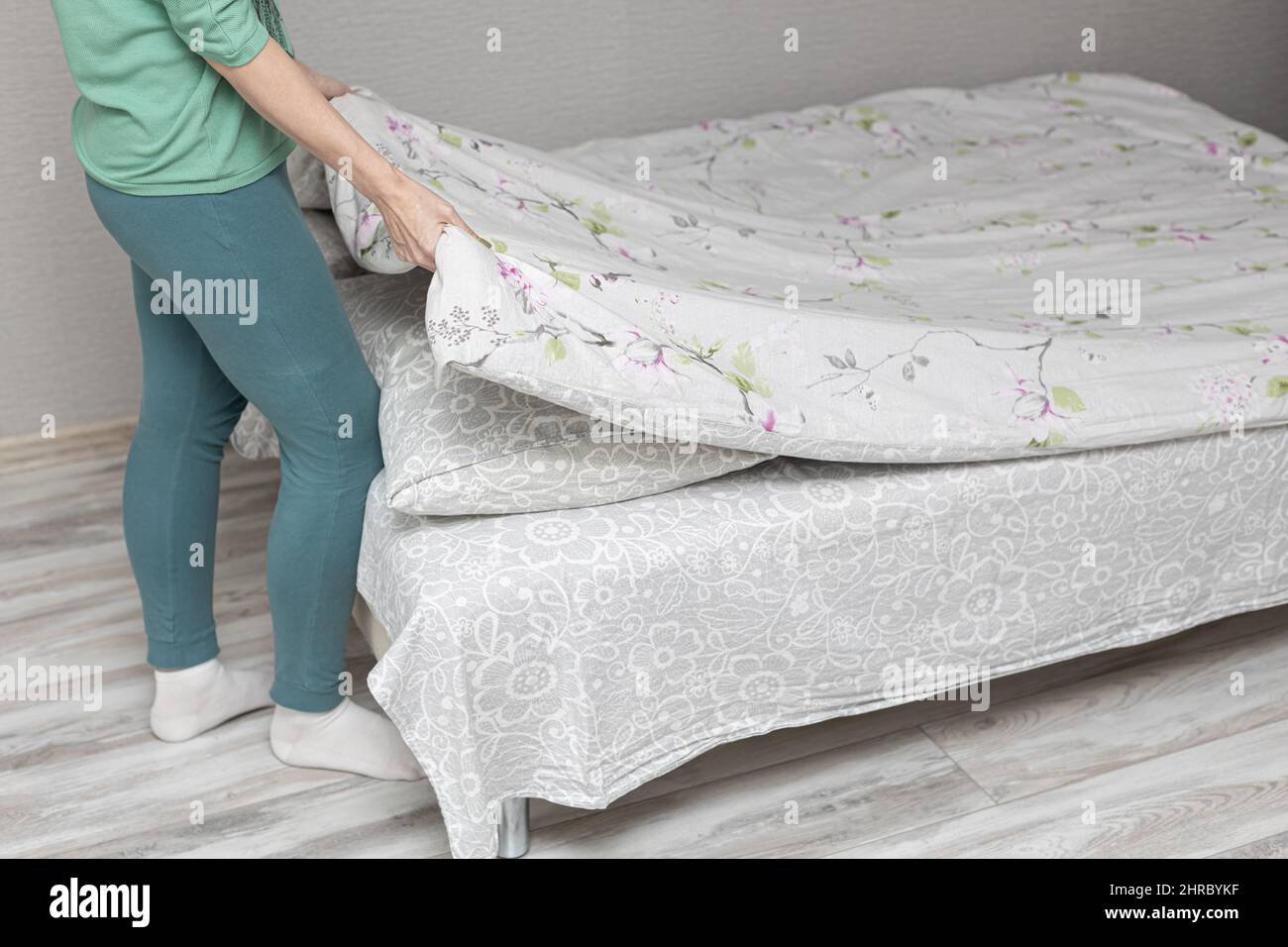 woman spreading pastel on the bed at home. High quality photo Stock Photo