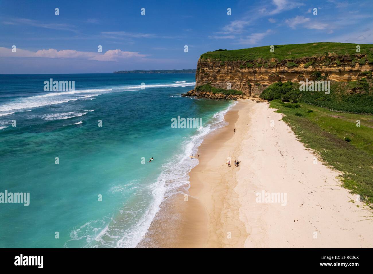Aerial view of surfers on Sungkun Beach, Lombok, West Nusa Tenggara, Indonesia Stock Photo