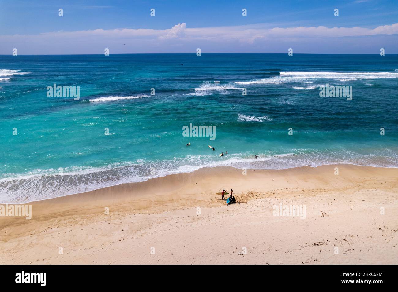 Aerial view of surfers on Sungkun Beach, Lombok, West Nusa Tenggara, Indonesia Stock Photo