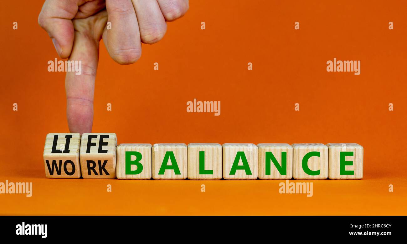 Work life balance symbol. Businessman turns cubes and changes concept ...