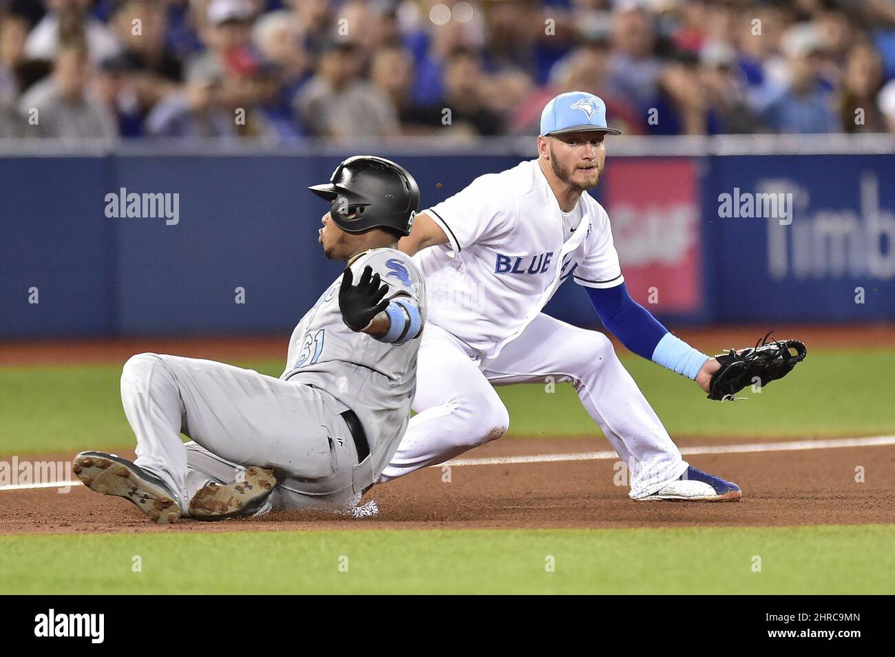 Chicago White Sox Willy Garcia slides safely into third base ahead of the  tag by Toronto Blue Jays third baseman Josh Donaldson (20) during fifth  inning American League baseball action in Toronto,