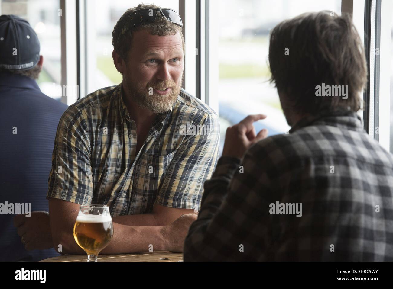 Tayce McAvity, left, and James Hansen enjoy some craft beer at Grimross Craft Brewing in Fredericton, N.B., on Friday, June 16, 2017. The craft brewing industry is booming in Fredericton and officials in New Brunswick's capital are hoping tourists will want to taste what the city has on tap. THE CANADIAN PRESS/Stephen MacGillivray Stock Photo