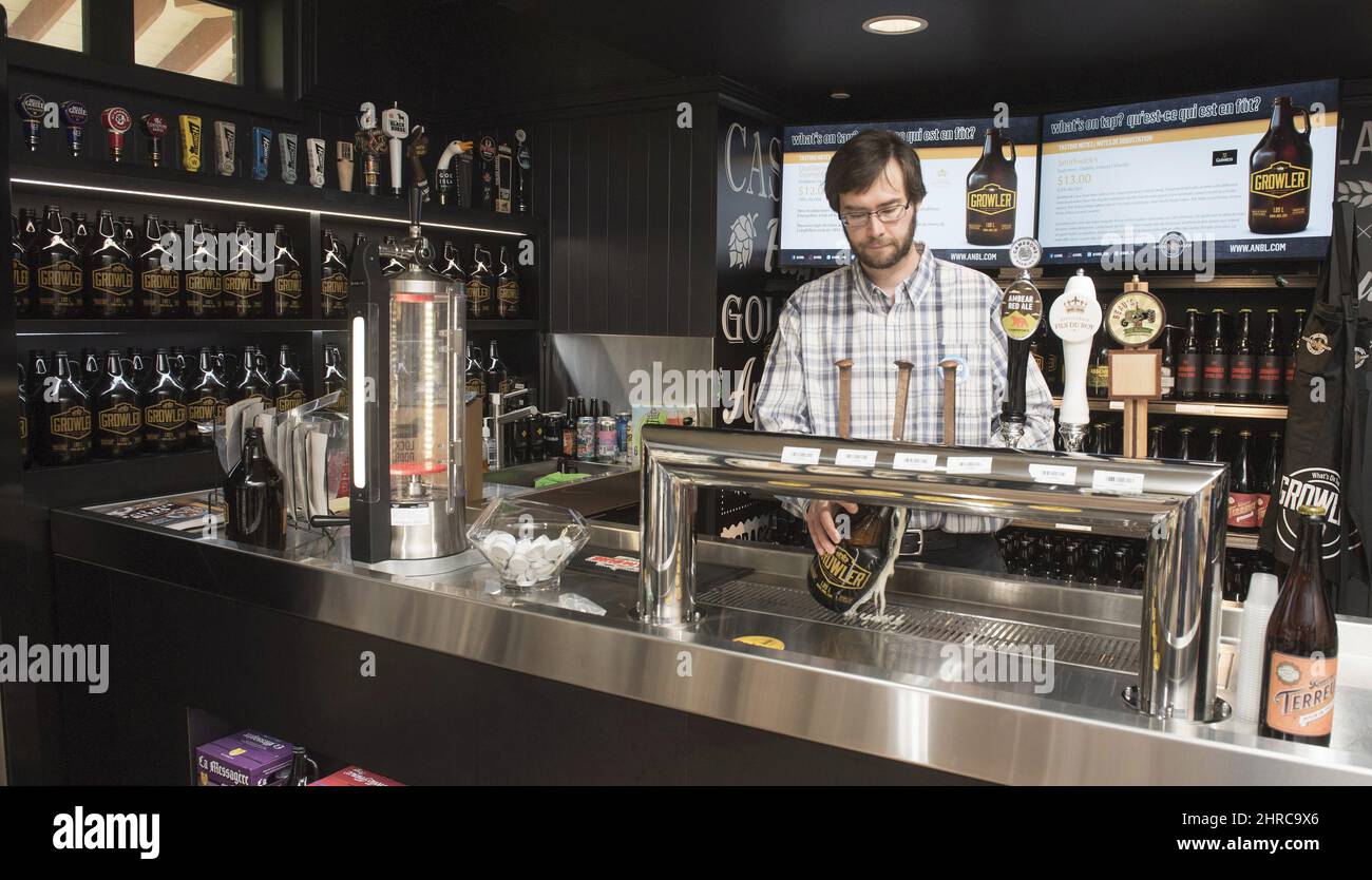 Kyle MurrayZelmer, product advisor with NB Liquor, pours a Growler in