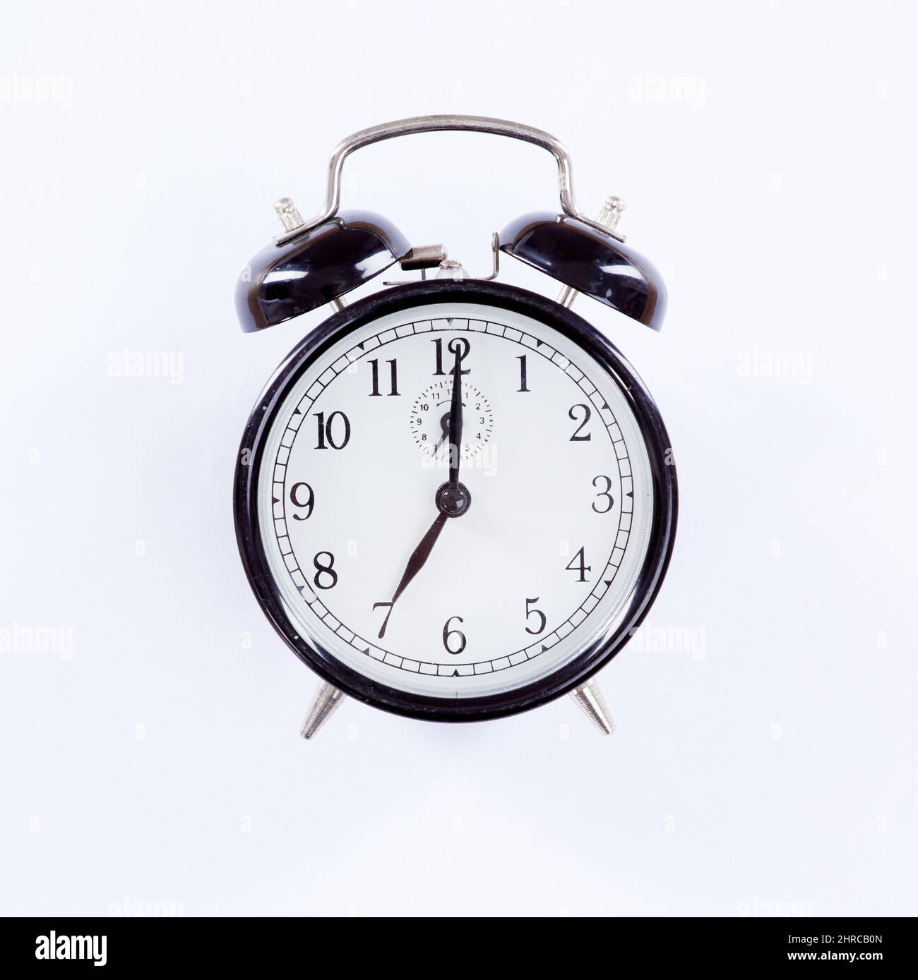 Only time will tell. An alarm clock isolated on white Stock Photo Alamy