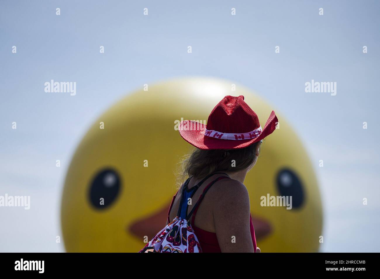 People celebrate Canada Day near the giant inflatable duck that sits on ...