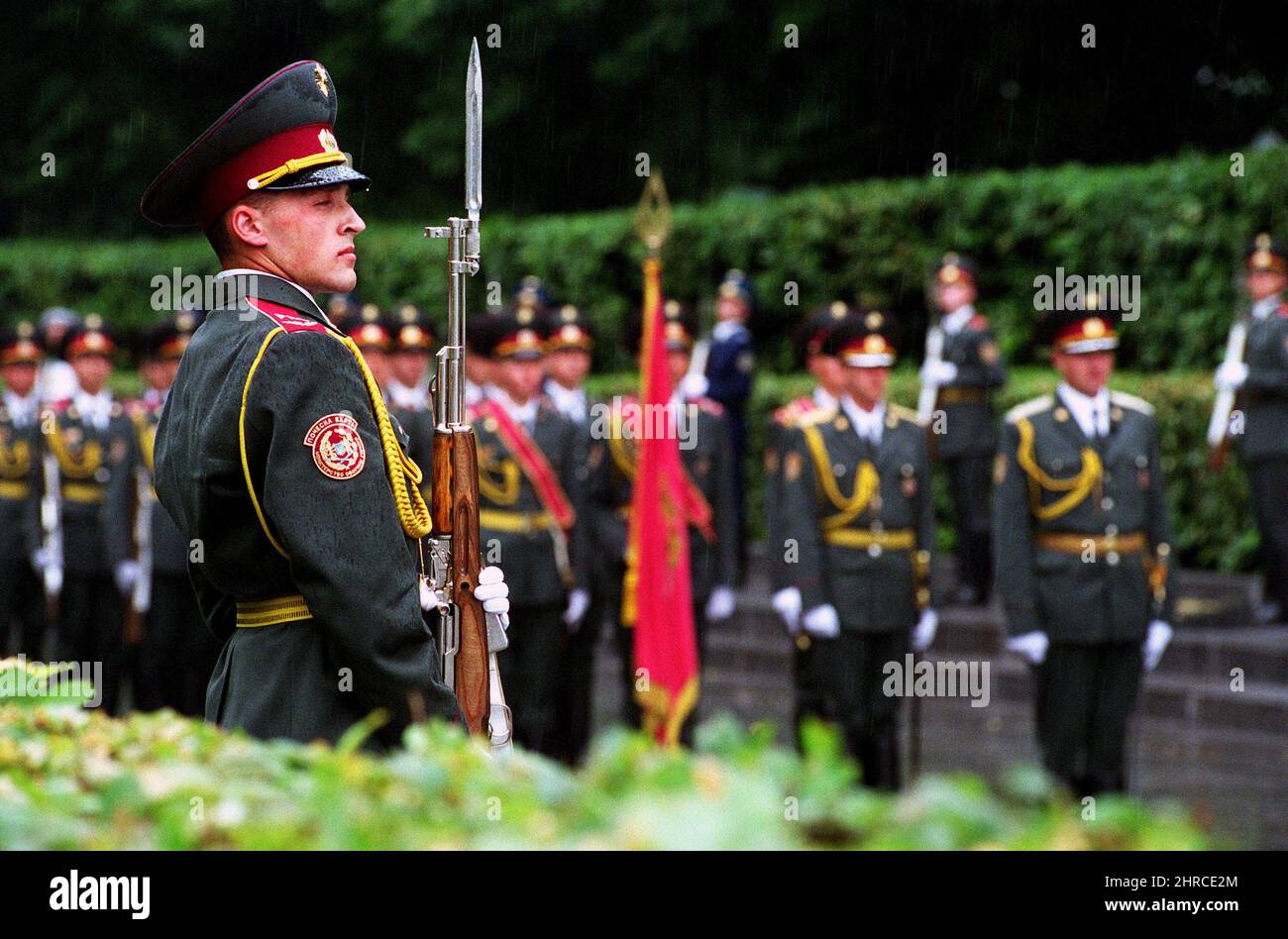 A Ukrainian Army honor guard stands in the rain at the War Memorial in Kiev, Ukraine, on Jun. 5, 2001.  (Department of Defense official photo by Robert D. Ward) Stock Photo