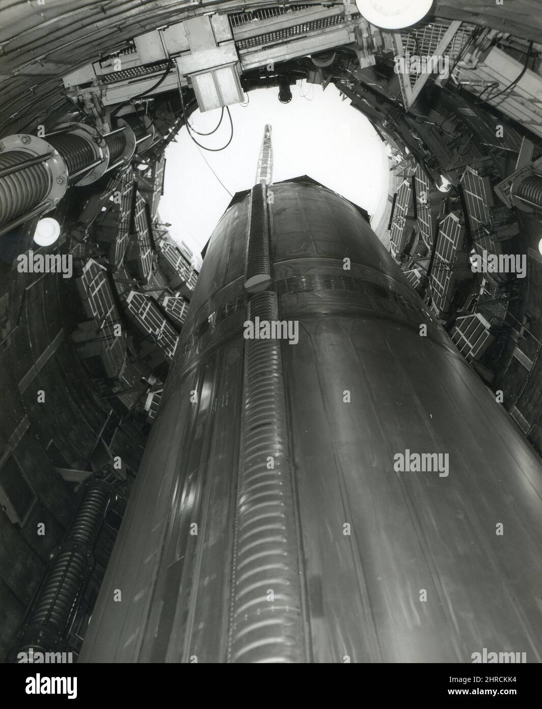 1963 - First stage of a Titan ICBM being lowered into its launch silo at McConnell, AFB, Kansas. Stock Photo