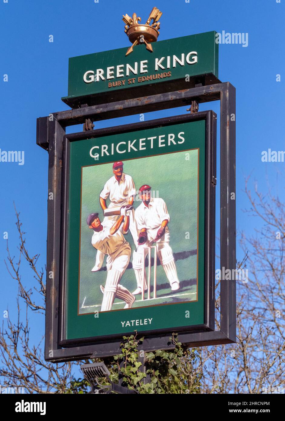 Traditional hanging pub sign at The Cricketers a Greene King public house, Cricket Hill Lane, Yateley, Hampshire, England, UK Stock Photo