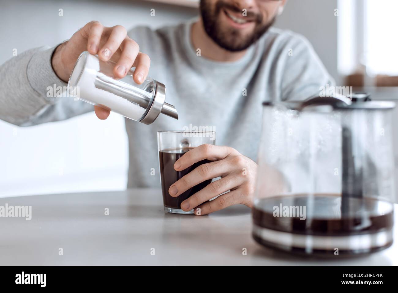 close up. sugar container with a dispenser in the hands of a man Stock ...