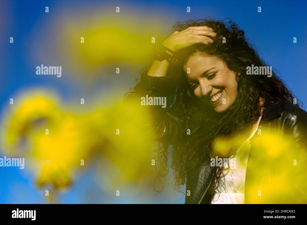 Happy hispanic female curly hi-res stock photography and images - Alamy