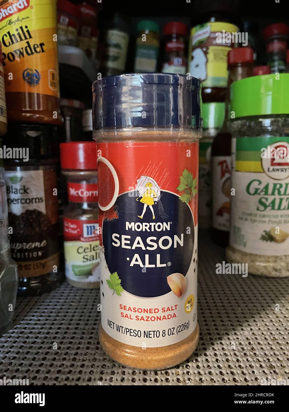 Vertical shot of a seasoning bottle with the inscription MORTON SEASON ALL  Stock Photo - Alamy