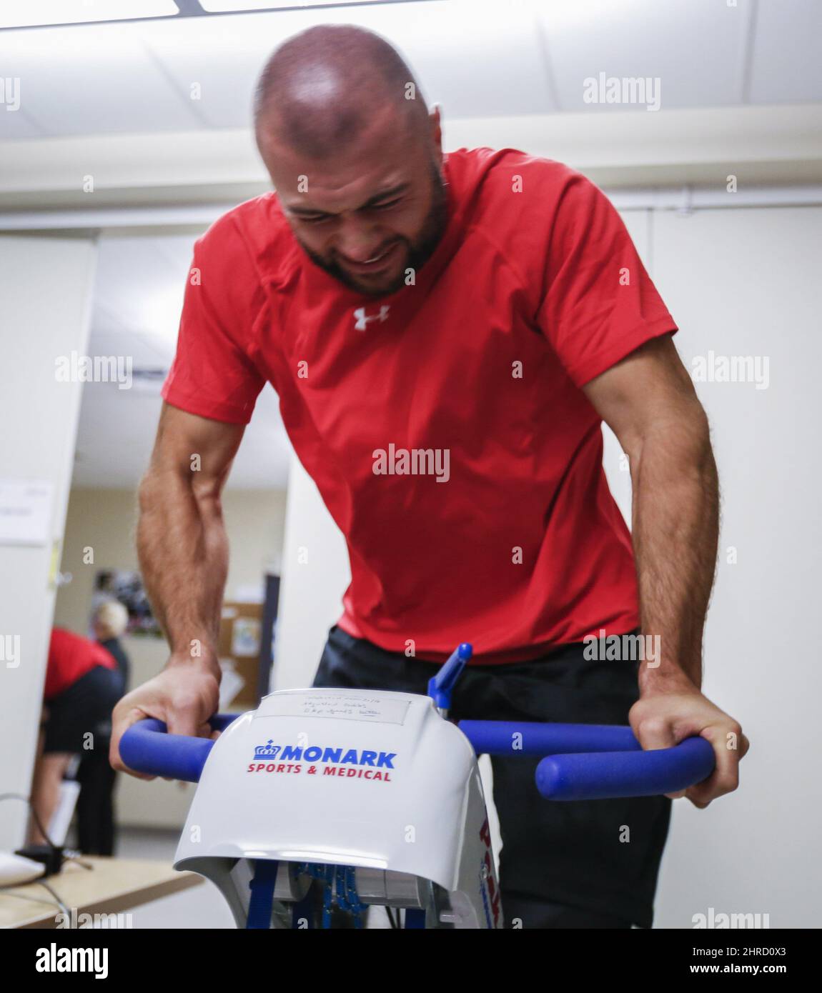 Calgary Flames' Mark Giordano rides a stationary bike during medical