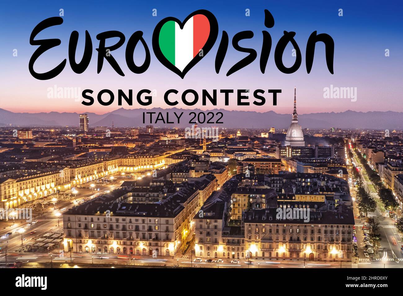 Eurovision Song Contest logo on on Turin's cityscape at night. The 66th edition will be held in Turin in May 2022. Turin, Italy - february 2022 Stock Photo