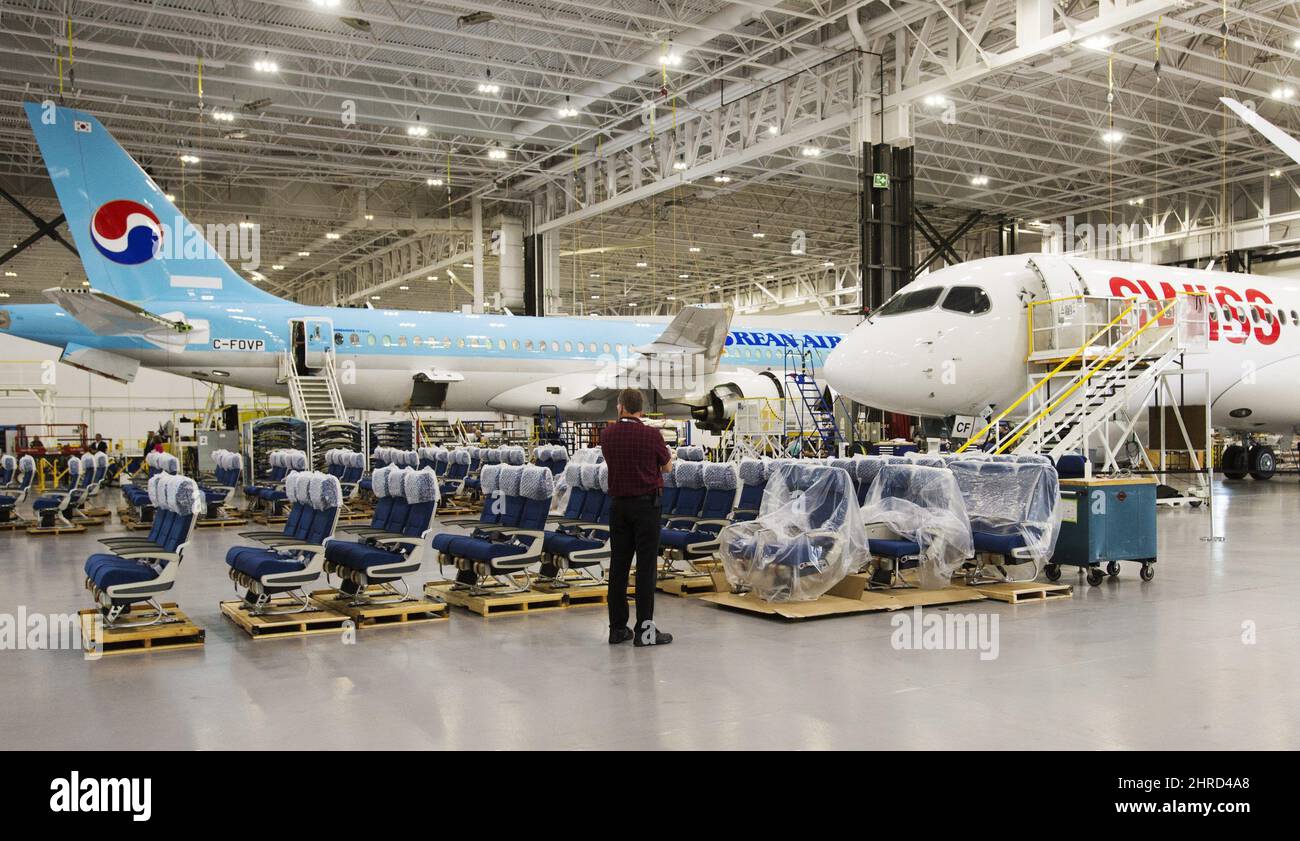 Bombardier employees work on CSeries 300 jets at the company's plant