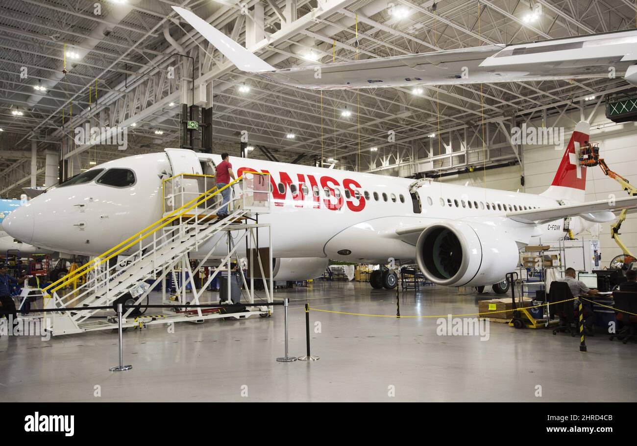 Bombardier employees work on CSeries 300 jets at the company's plant