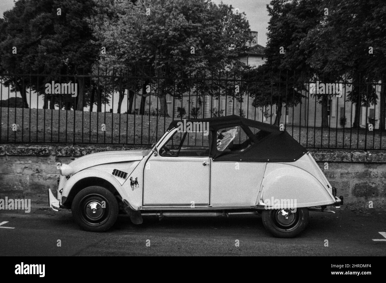 Grayscale of a classic Citroen 2CV car on the street Stock Photo