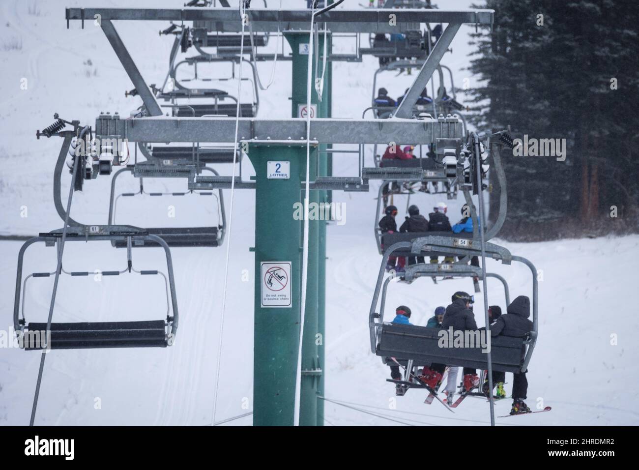 Skiers wait on the chair lift after a power failure shut down all