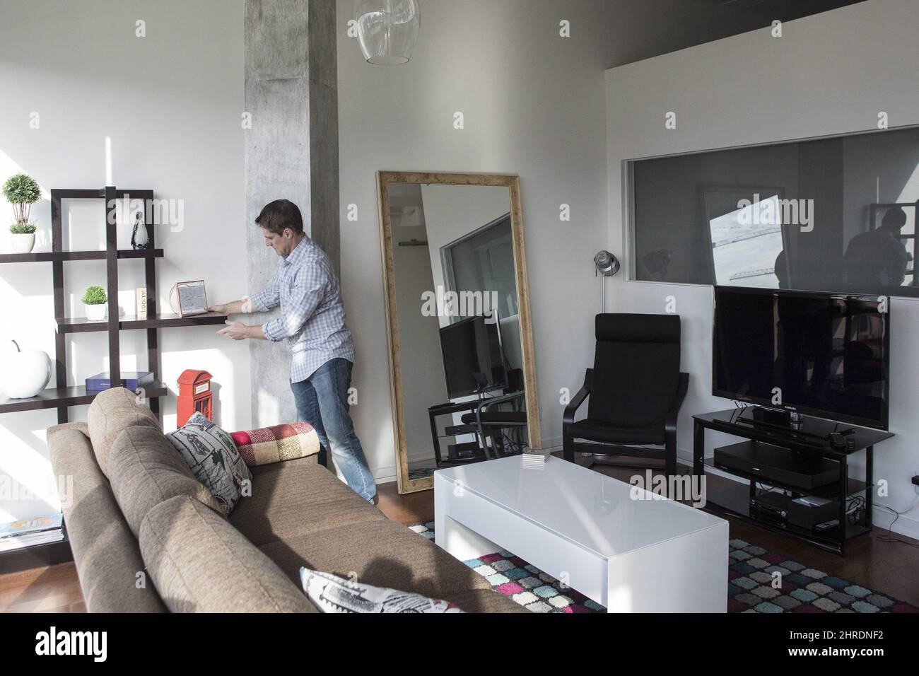 Kevin Makra is pictured preparing for guests in his Toronto Airbnb rental apartment, on Saturday, December 2, 2017. Politicians in Toronto will be scrutinizing proposed rules for short-term rentals this week that could spell major changes for those who offer secondary residences for rent on platforms like Airbnb. THE CANADIAN PRESS/Chris Young Stock Photo