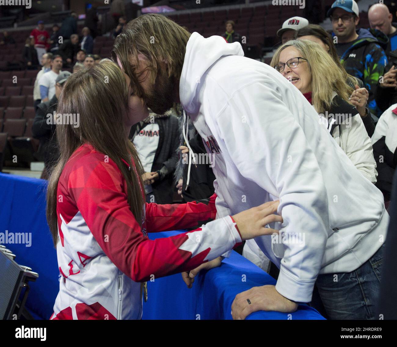Skip Rachel Homan, from Ottawa, Ont. kisses her husband Shawn Germain