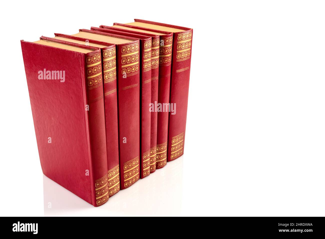 Red vintage books with golden decorations isolated on white, clipping