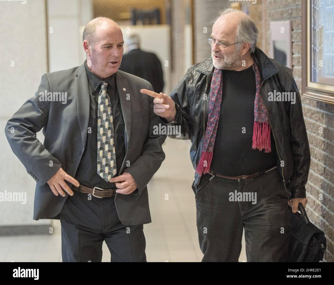 Train engineer Thomas Harding, left, leaves the courtroom with his lawyer  Tom Walsh as the jury begins deliberations at the courthouse Thursday,  January 11, 2018 in Sherbrooke, Quebec. THE CANADIAN PRESS/Ryan Remiorz, image size:1300x1110