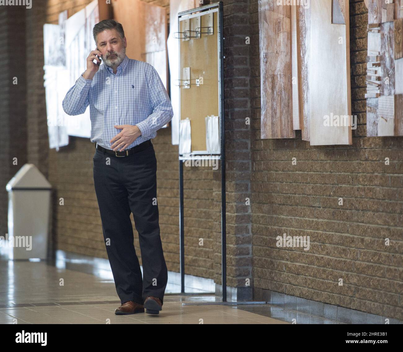 Manager of train operations Jean Demaitre , chats on the phone as he waits in the courthouse while the jury deliberates for the fourth day Sunday, January 14, 2018 in Sherbrooke, Que. THE CANADIAN PRESS/Ryan Remiorz Stock Photo