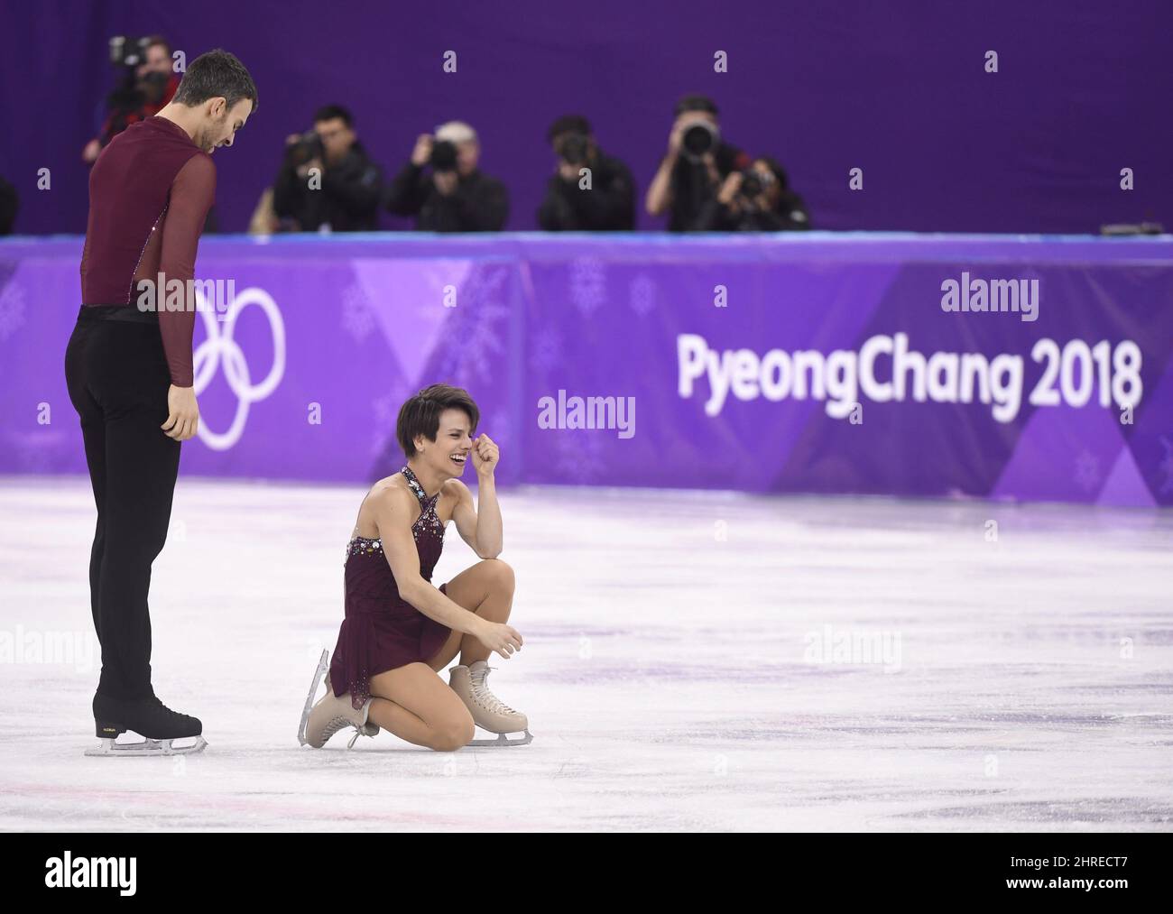 Canada's Meagan Duhamel and Eric Radford react after their pairs figure