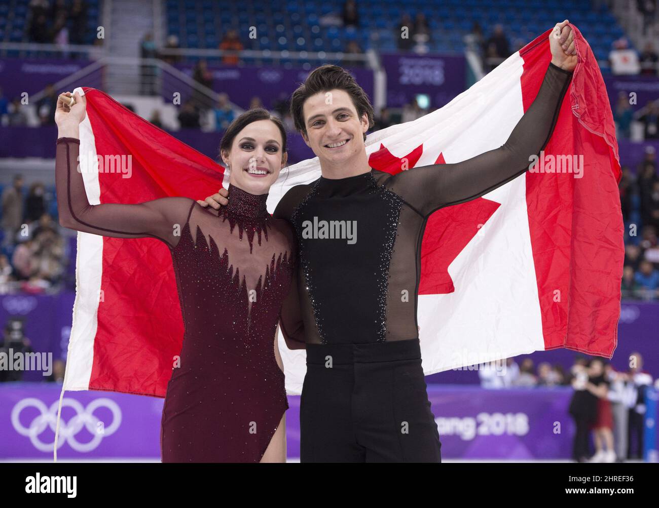 Ice dance gold medalists Canada's Tessa Virtue and Scott Moir hold up