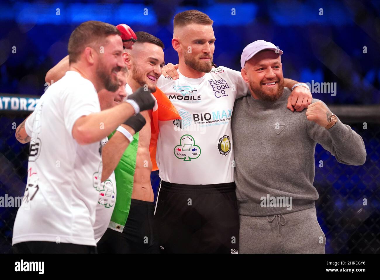 UFC fighter Conor McGregor (right) poses for a photo with SBG team mate Lee  Hammond (centre) and coaches John Kavangh (left), Phil Sutcliffe Jr (second  left) and Cian Cowley right after the
