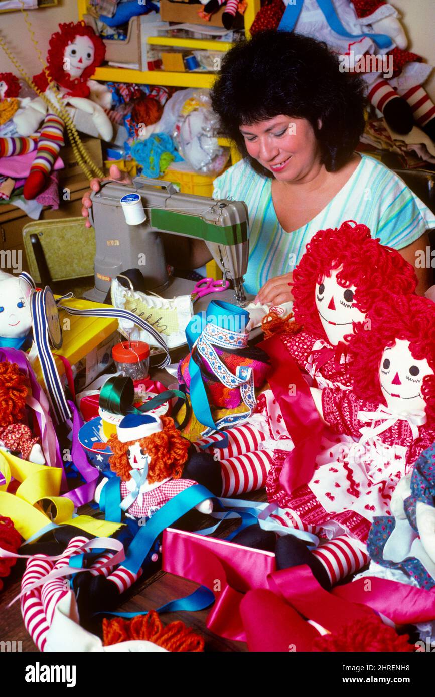 1980s LATINO WOMAN DOLL TOY MAKER AT SEWING MACHINE WORKING FROM HOME