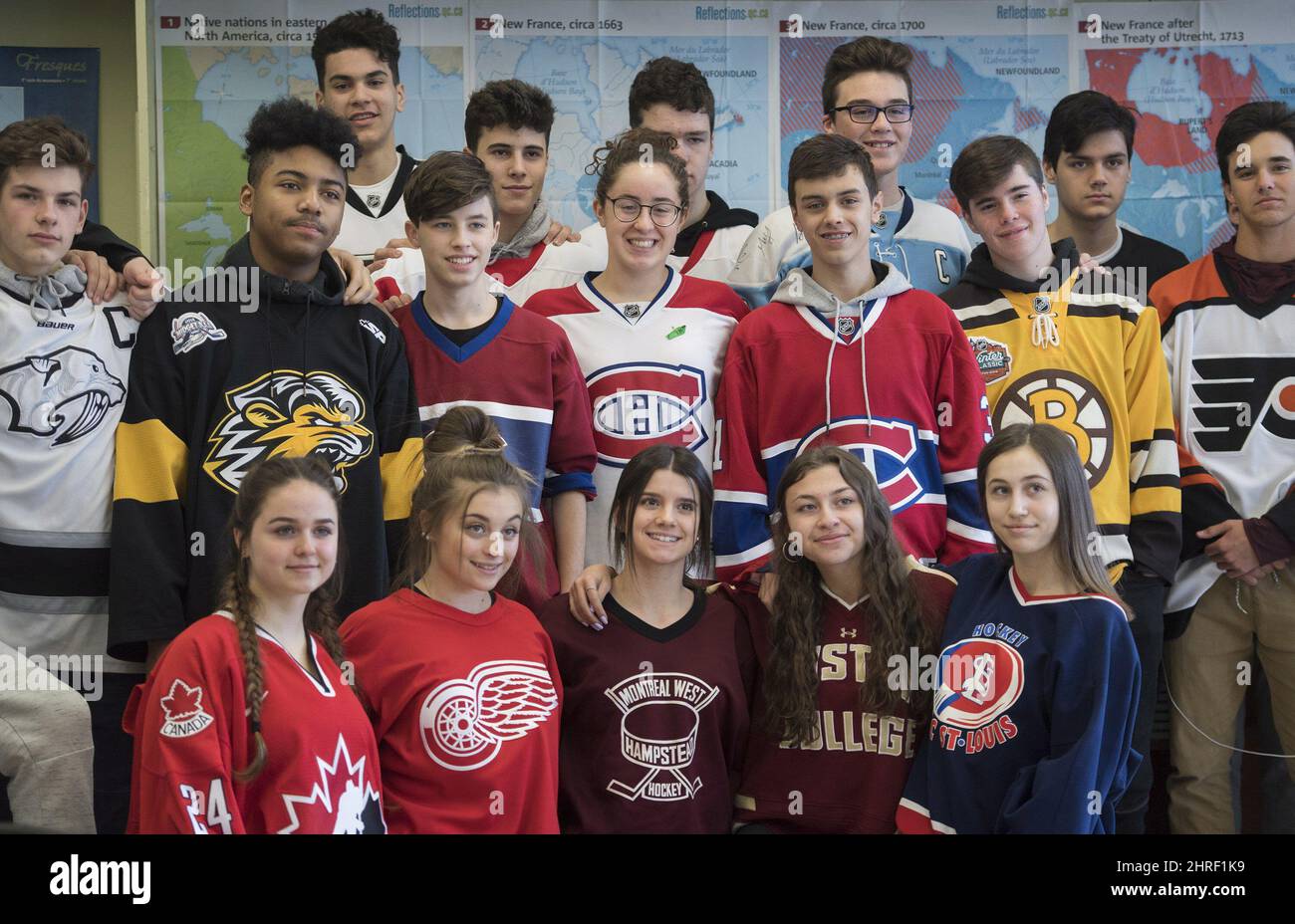 John Rennie High School students wear jersey's as they pose for a class ...