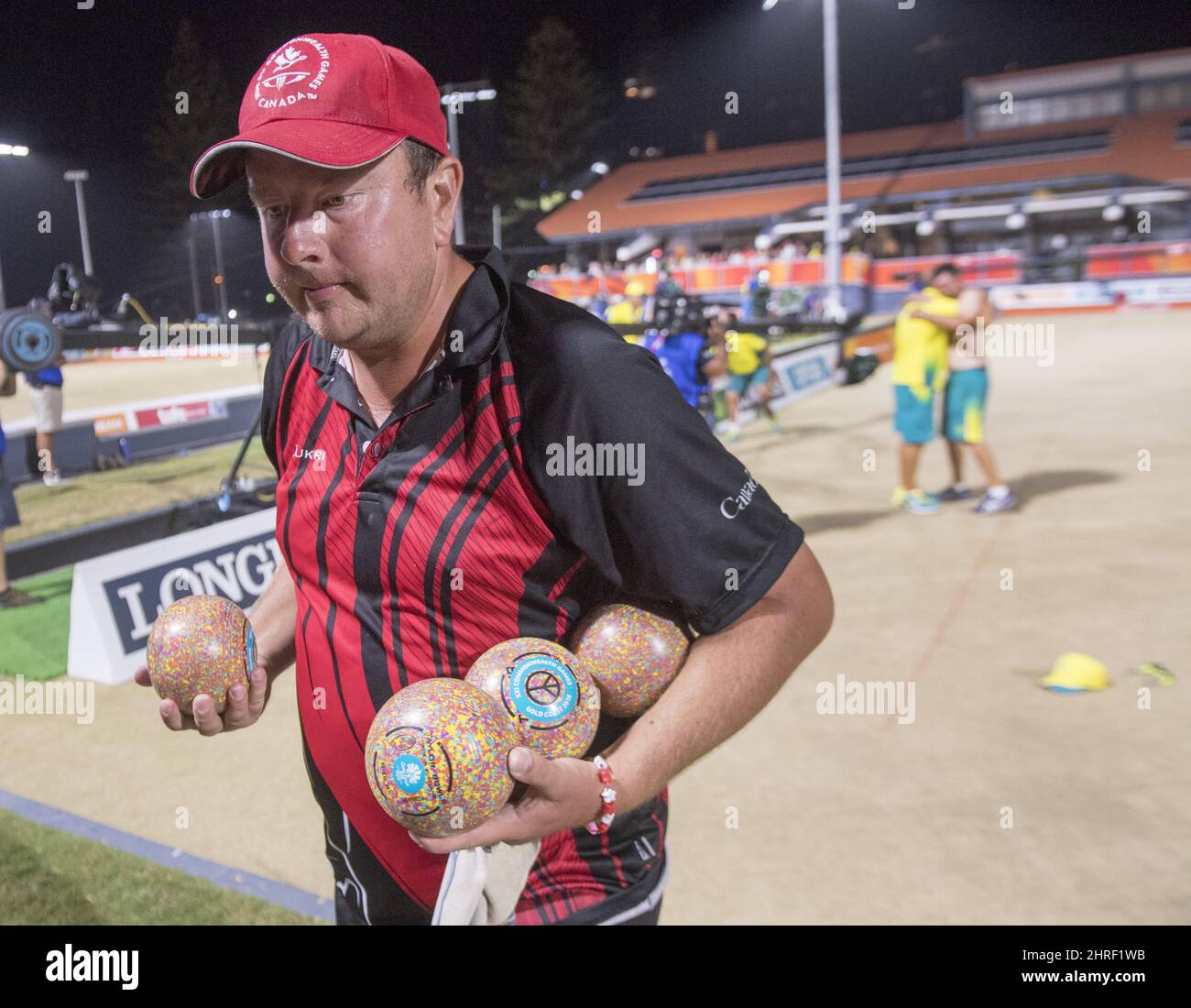Canada's Ryan Bester leaves the green as Australia's Aaron Wilson celebrates after winning the
