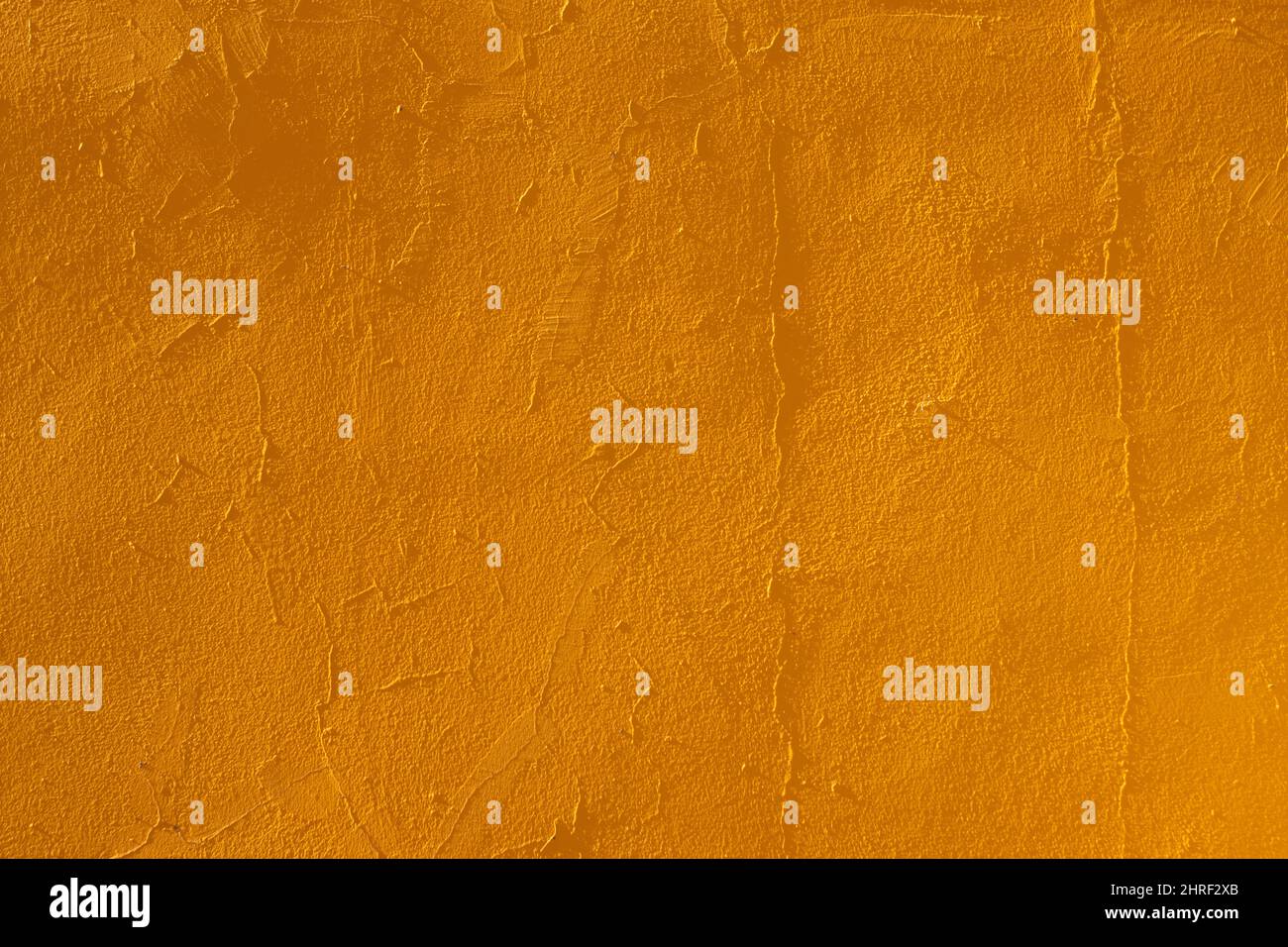 Close-uptexture of an orange yellow wall with agglomerated granite Stock Photo