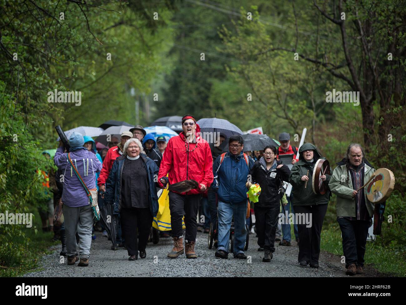 Vivian Seegers, second left, a transitional deacon in the Anglican Church, who is Cree and Chipewyan, and Cedar George-Parker, third left, lead religious leaders and more than 100 members of diverse faith communities to a gate at Kinder Morgan's facility in Burnaby, B.C., to protest the company's Trans Mountain pipeline expansion, on Saturday April 28, 2018. THE CANADIAN PRESS/Darryl Dyck Stock Photo