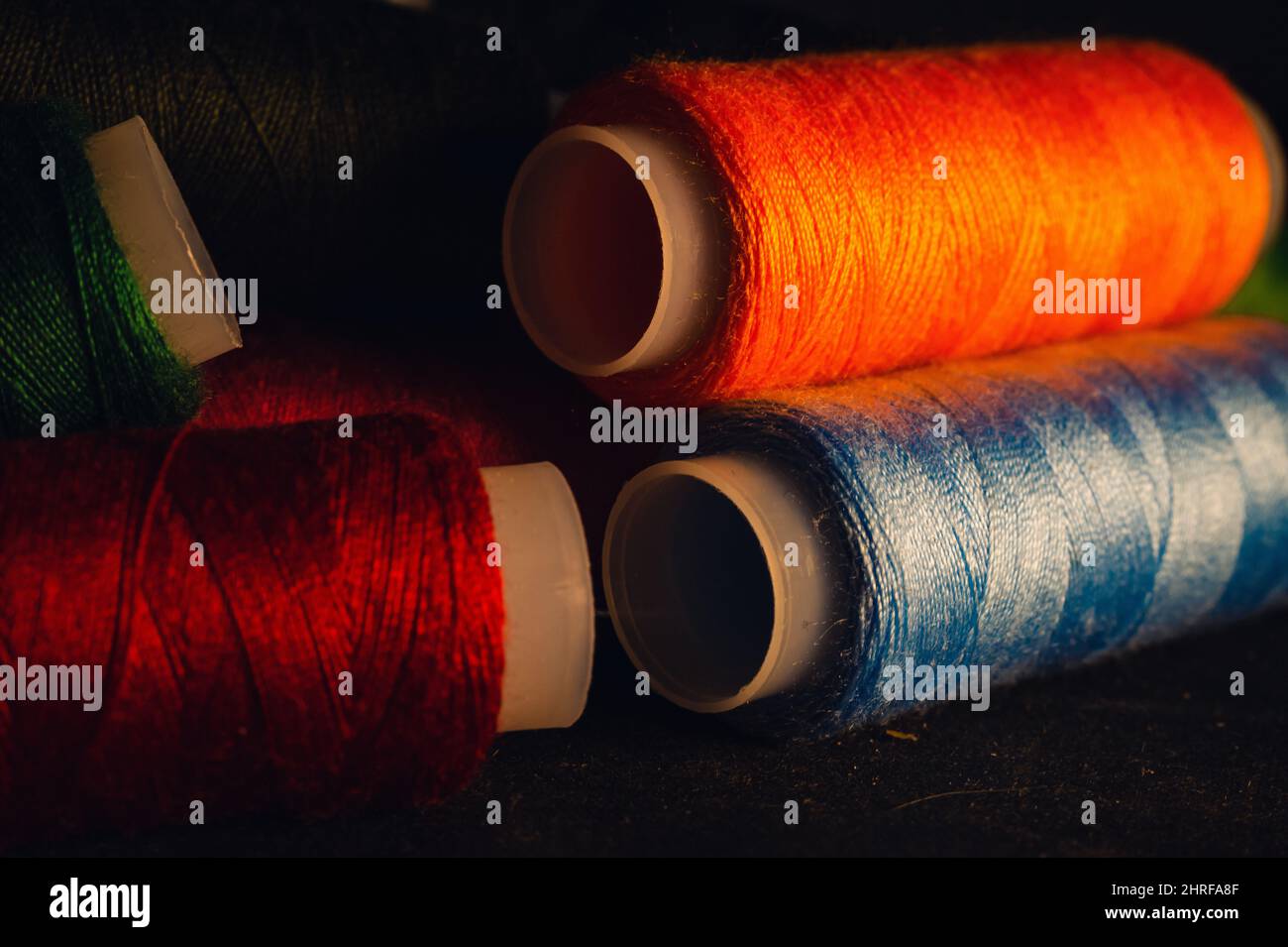 Closeup of colorful nylon threads set on a dark background Stock Photo ...