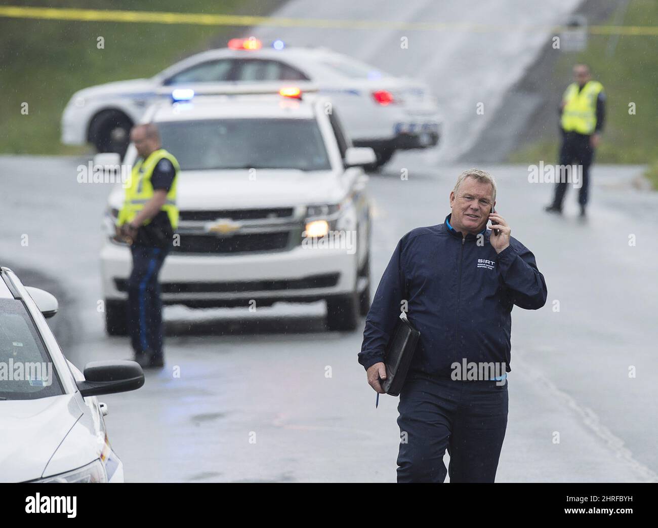 A mmember of Nova Scotia's Serious Incident Response Team investigates a shooting which left one person dead in Dartmouth, N.S., on Saturday, May 26, 2018. SIRT investigates all serious incidents involving police. THE CANADIAN PRESS/Andrew Vaughan Stock Photo