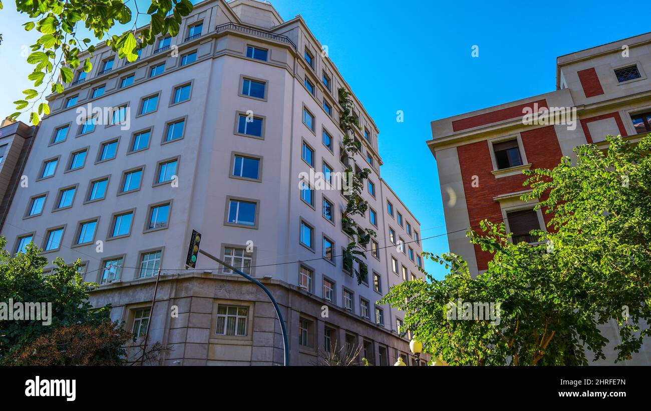 Low angle shot of residential buildings under a blue sky Stock Photo ...
