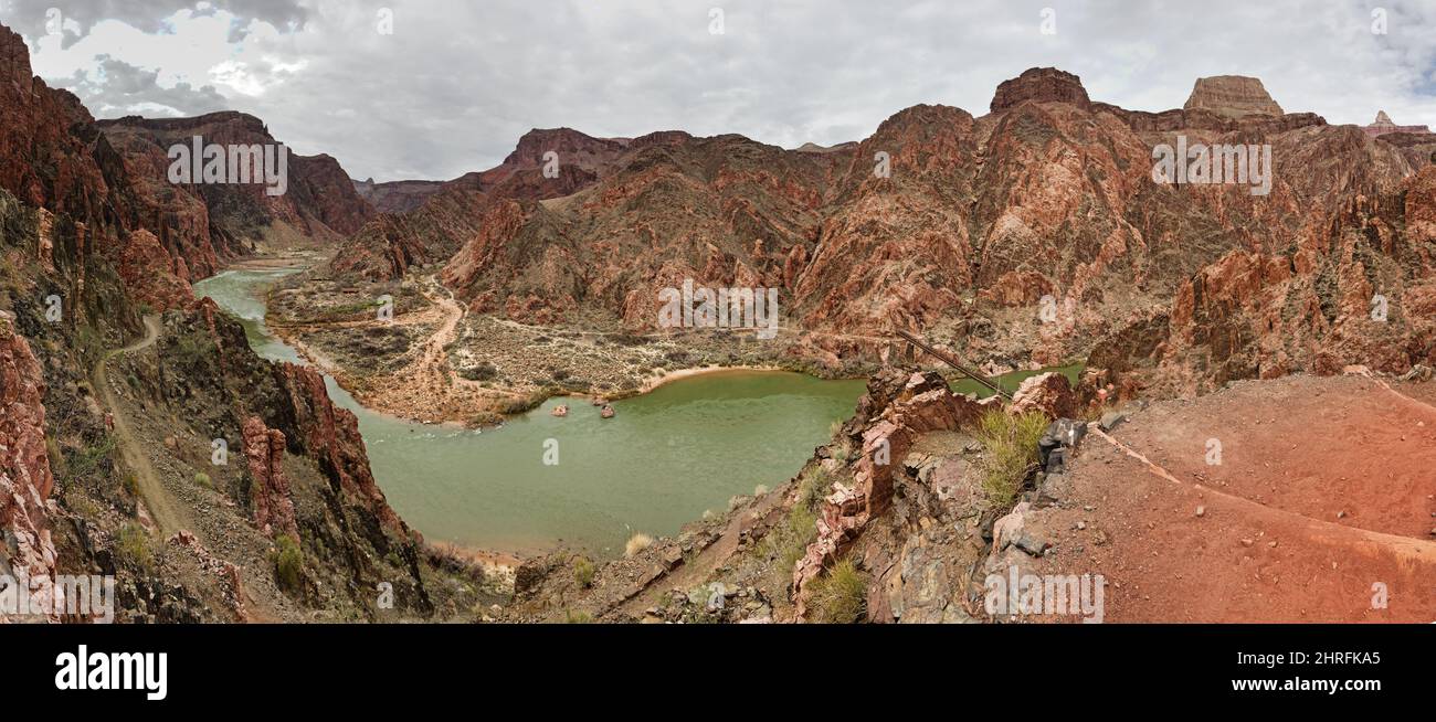 panorama from the South Kaibab Trail in the inner gorge in Grand Canyon National Park with the Colorado River and black bridge near Phantom Ranch Stock Photo