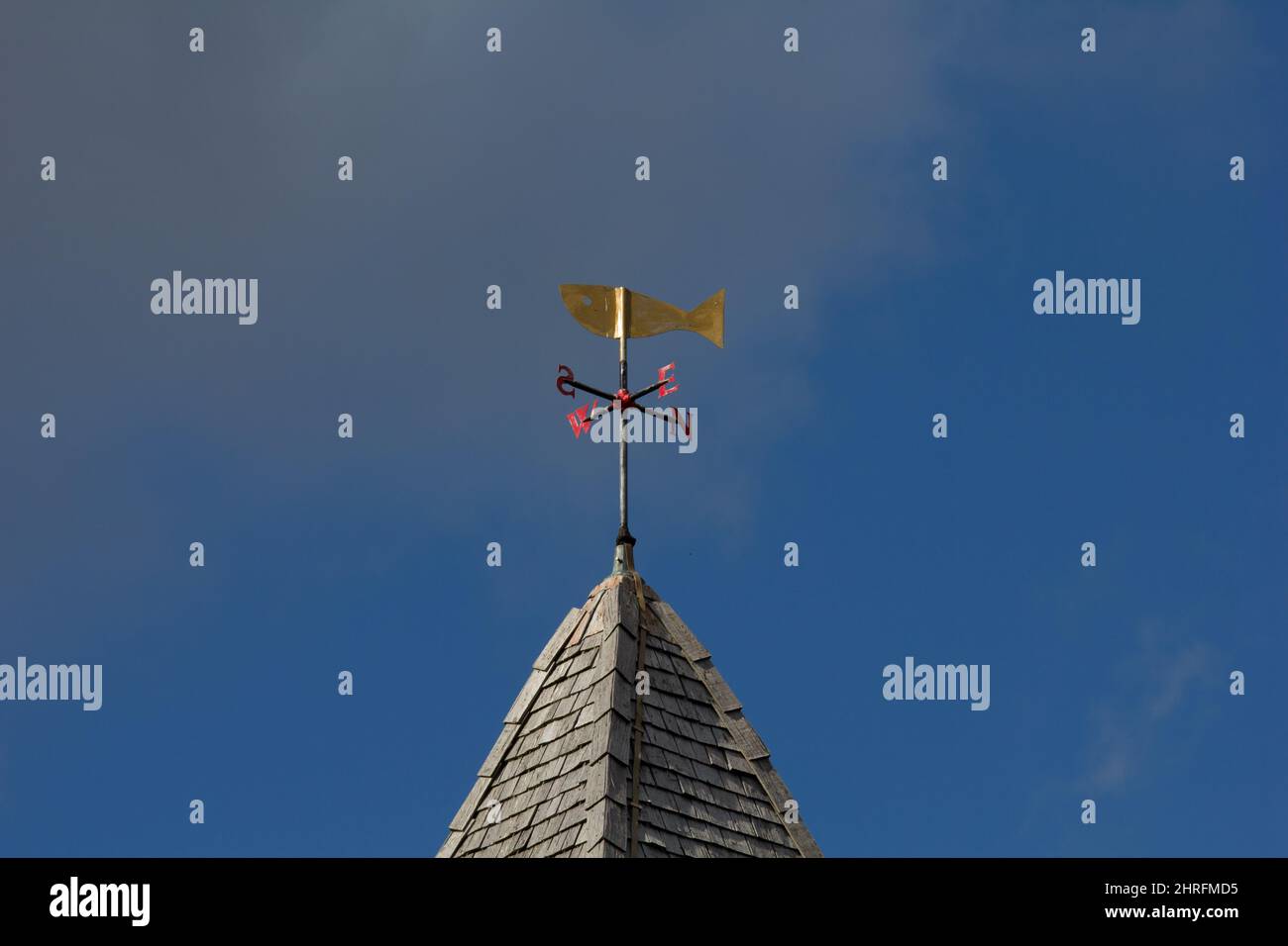 Weather vane on the steeple of St Mary the Virgin church within the walls of the Roman town of Calleva.  On the site of Roman temples. Stock Photo