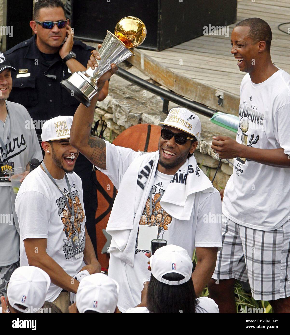 San Antonio's Kawhi Leonard holds up the NBA Finals' Most Valuable Player  trophy during the Spurs' parade and celebration of the Spurs' 5th NBA  Championship in San Antonio, Texas, Weds., June 18,
