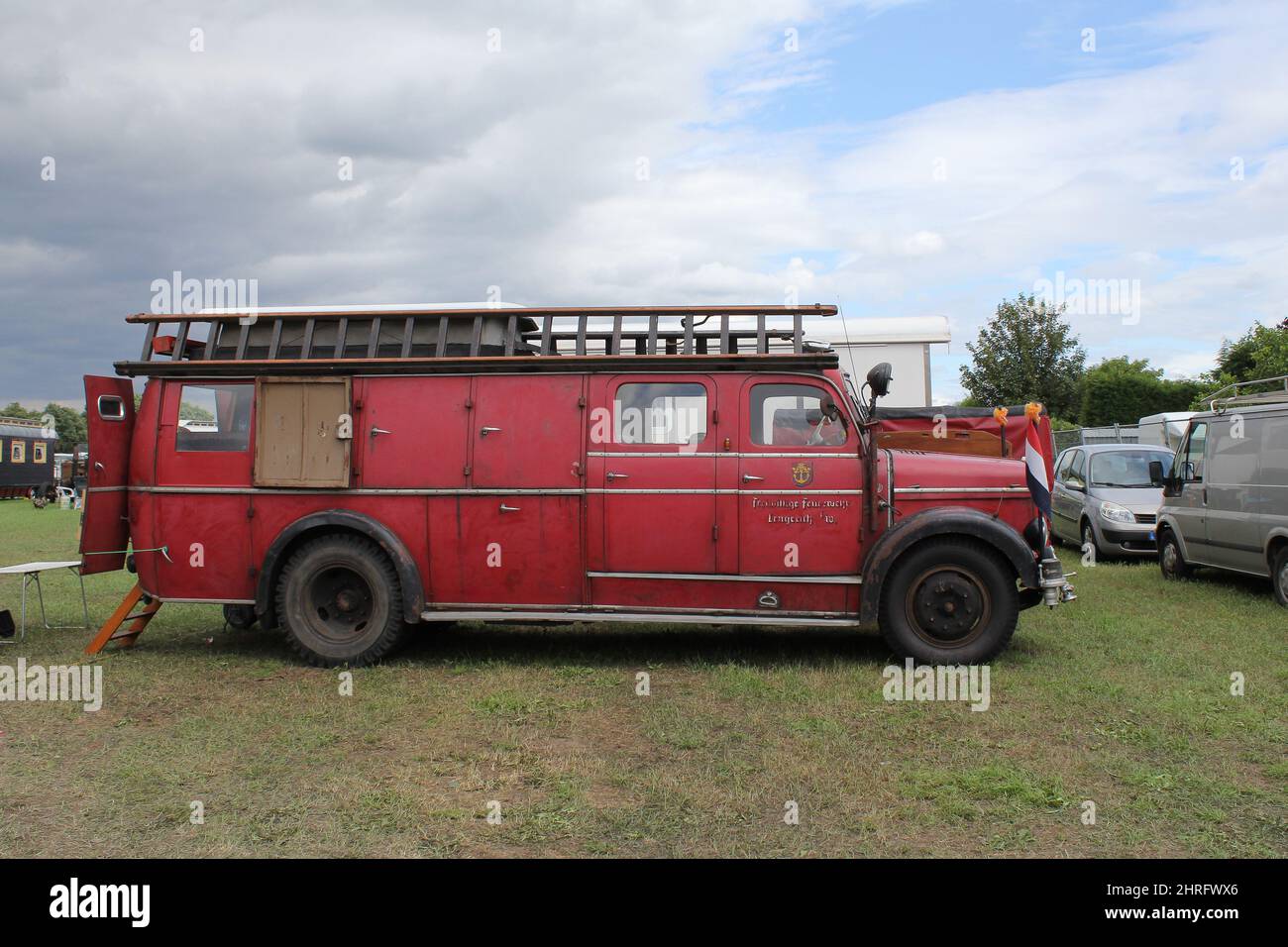 a beautiful vintage red fire engine at a show with historical vehicles at the great dorset steam fair in england in summer Stock Photo