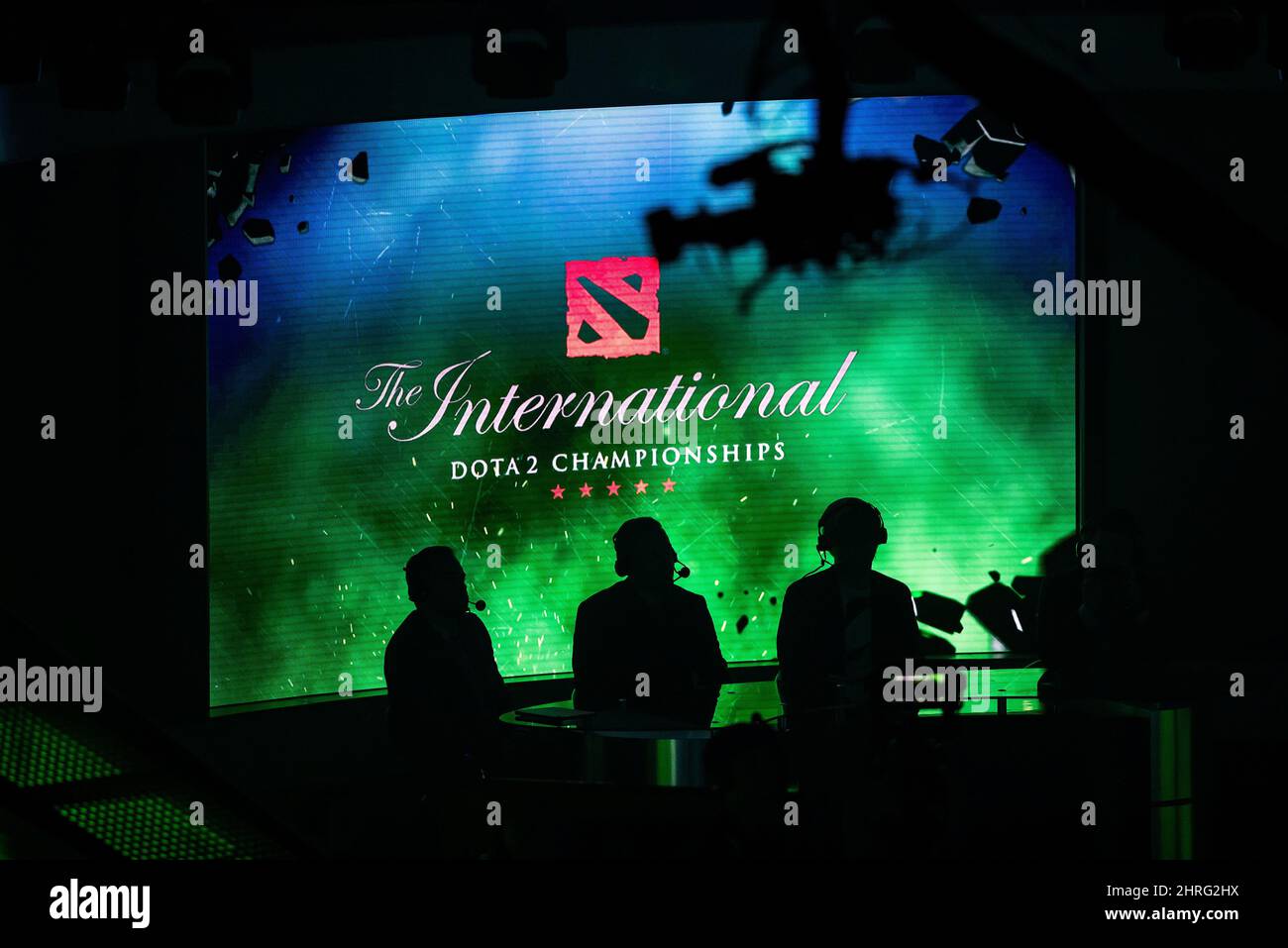 Announcers are silhouetted during the International Dota 2 Championships in Vancouver, on Monday August 20, 2018