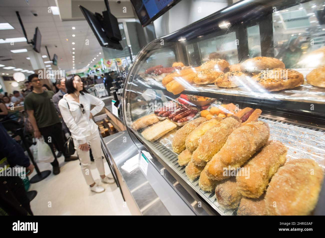 people-line-up-at-an-asian-street-food-area-at-t-t-supermarket-s-newest