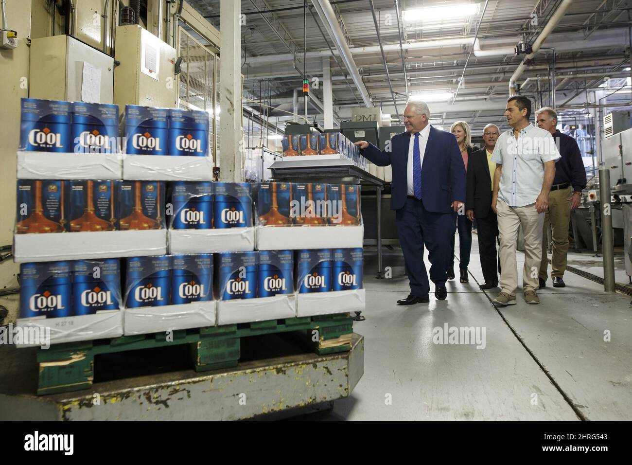 Ontario Premier Doug Ford, right, takes part in a photo opportunity at