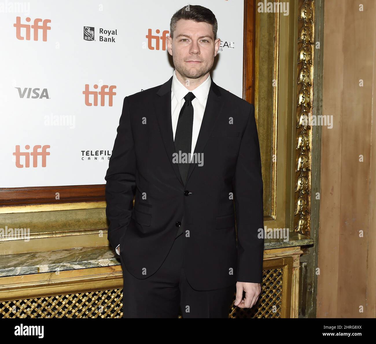 Actor Patrick Fugit poses for photographs on the red carpet after